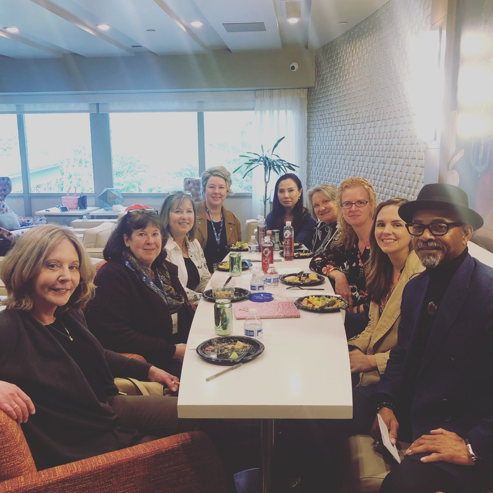 Holly at a luncheon table with a group of destination service consultants